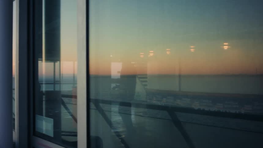 A man walking outdoors at an airport