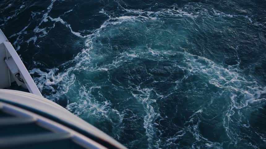 Foamy waves in the sea below the ship
