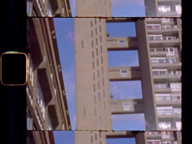 A Brutalist high rise building in the sunshine