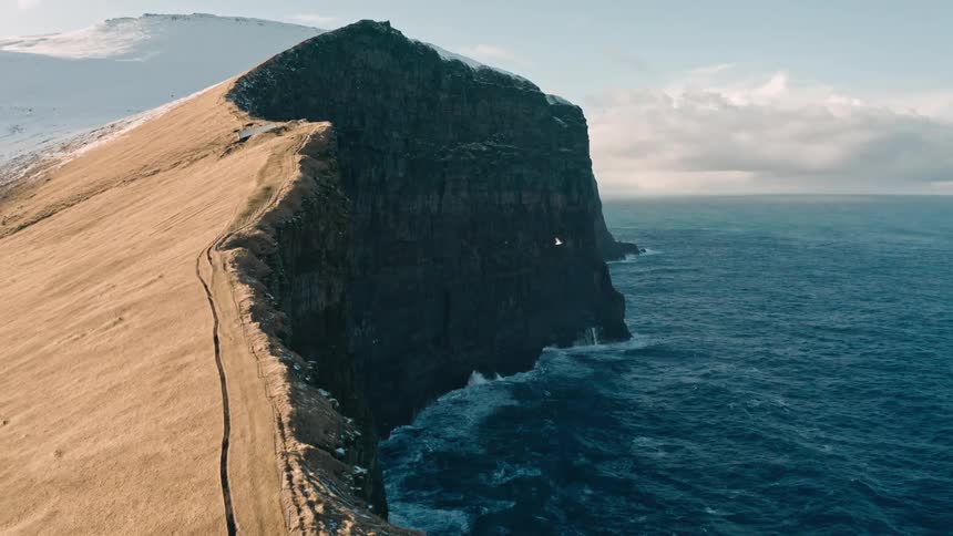 A clip of a mountain by the sea shore