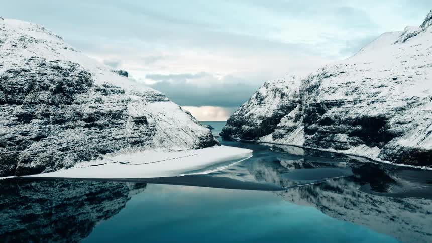Water surrounds the mountains