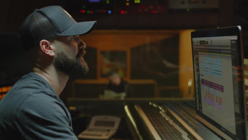 A clip of musicians producing music in the studio