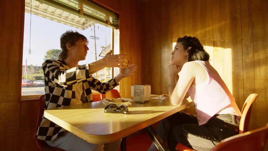 Two people talk in the restaurant