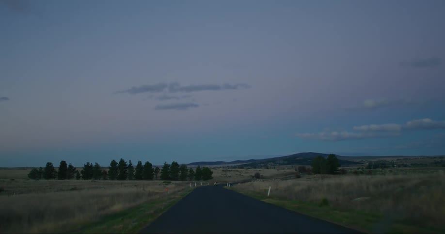 A clip of a freeway along the lane grass land