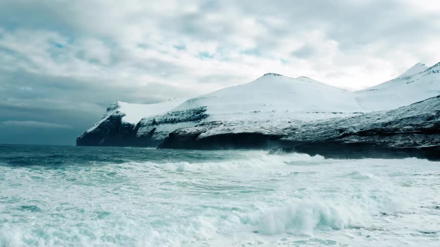 Large waves crash on the shore