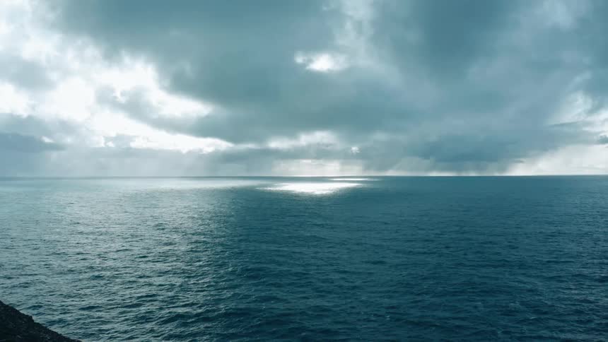 Heavy clouds are over the ocean