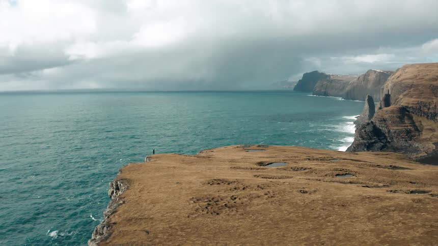 Aerial panorama of the coastline and promontory with cliffs by the sea