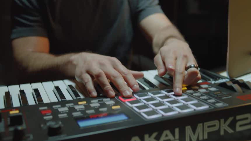 A man is playing a keyboard