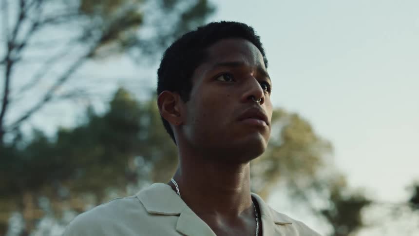 A man is standing outside