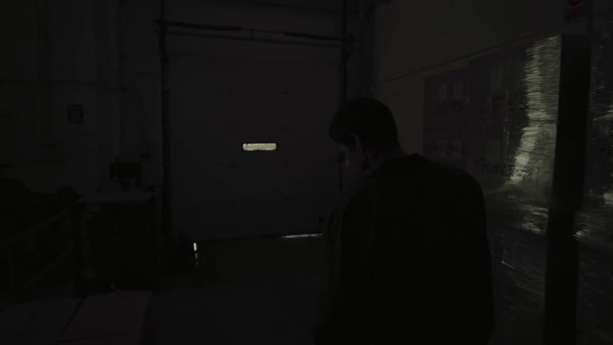A boy looking around a warehouse