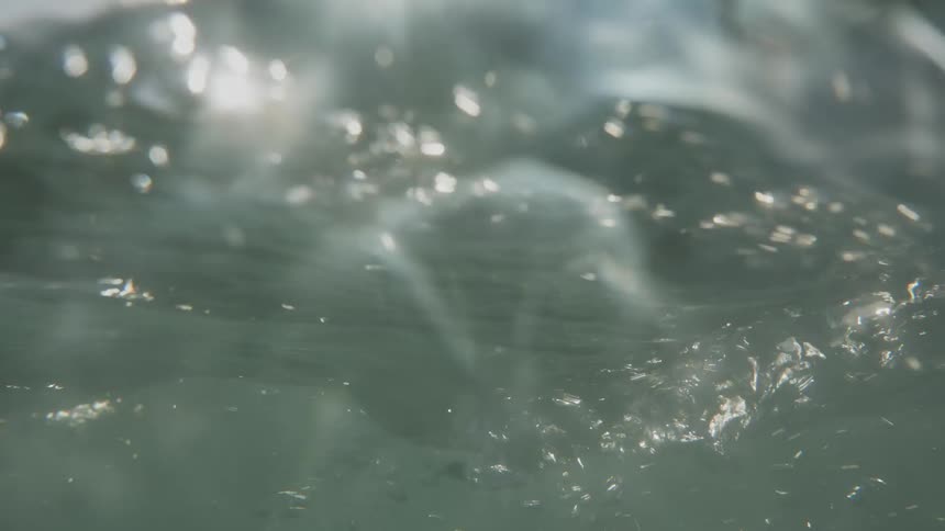Bright sunshine shines through translucent waves