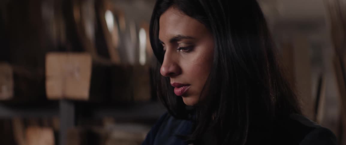 Portrait of a young woman in a woodworking space