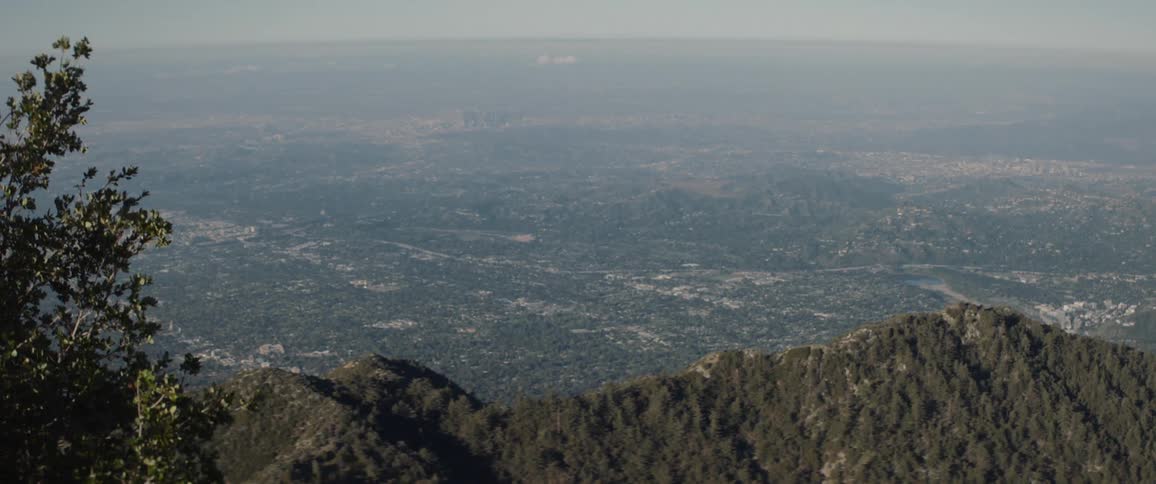 Overlooking a mountain ridge and the horizon on a hazy day
