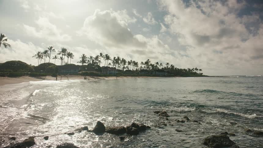 A tropical bay beach on a cloudy day