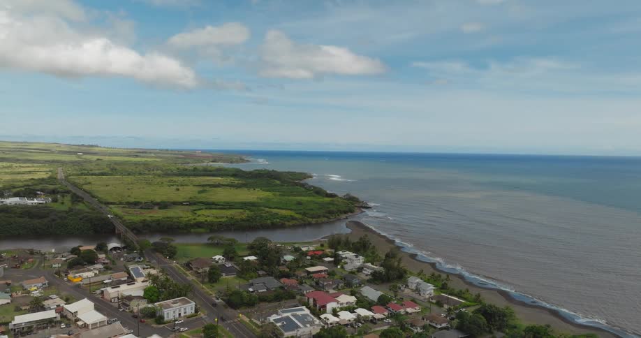 Aerial panorama of a residential neighborhood by a beach during the day