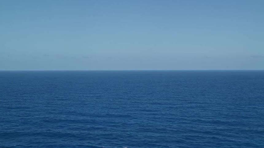 Panoramic view of the blue sea on a cloudless day with a clear blue sky