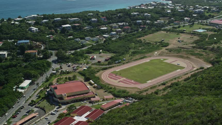 A campus and field are near the coastal town