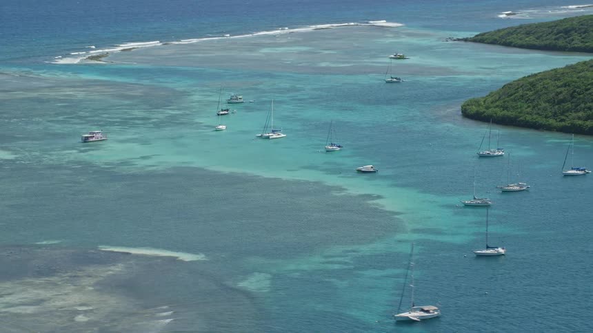 An aerial clip of the sea and some boats and ship on it