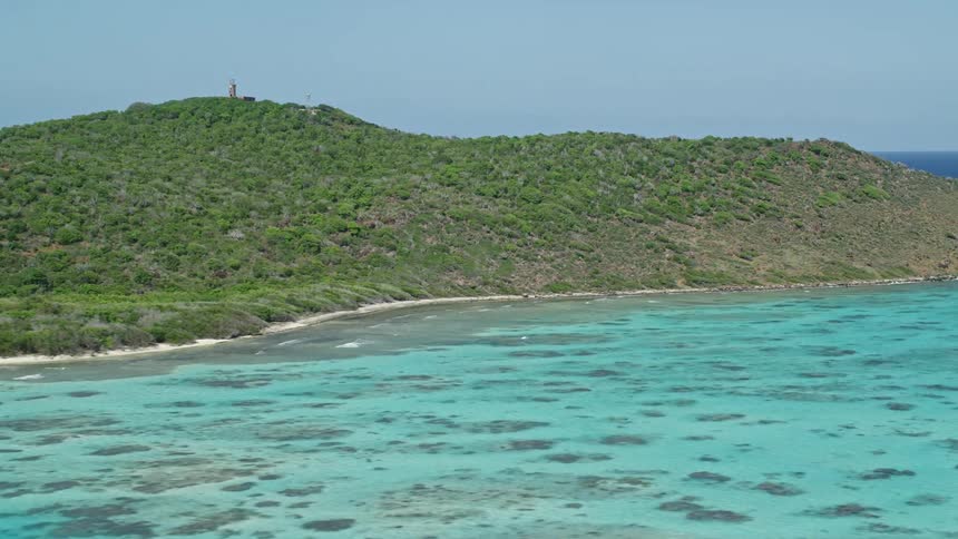 Blue waters surround the small island