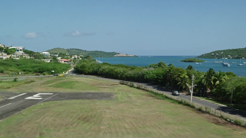 View of a seaside runway extending into a bay