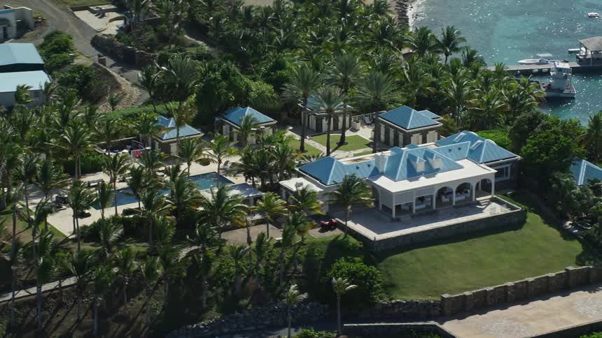 Aerial view of a tropical resort next to the ocean