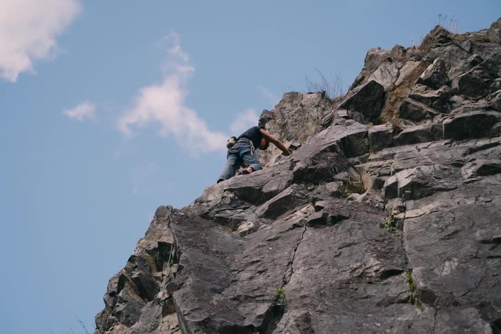 A clip of a person rock climbing