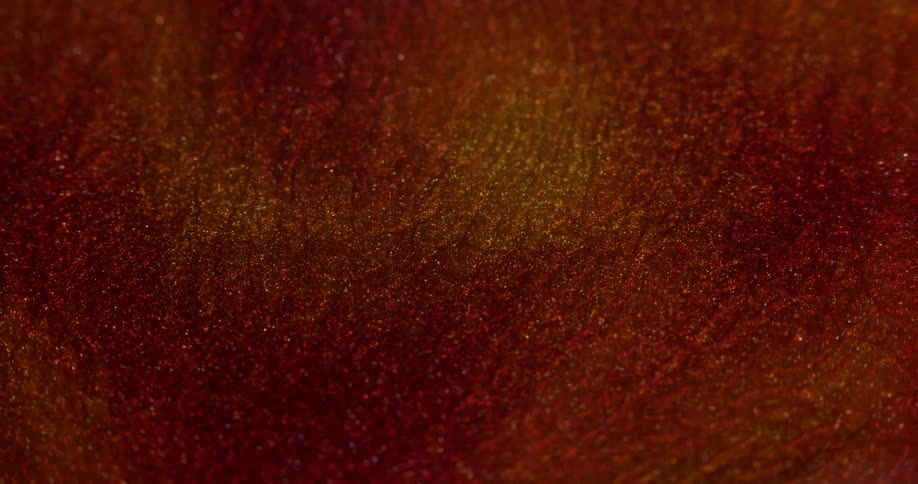 Extreme closeup of an abstract red glowing fluid