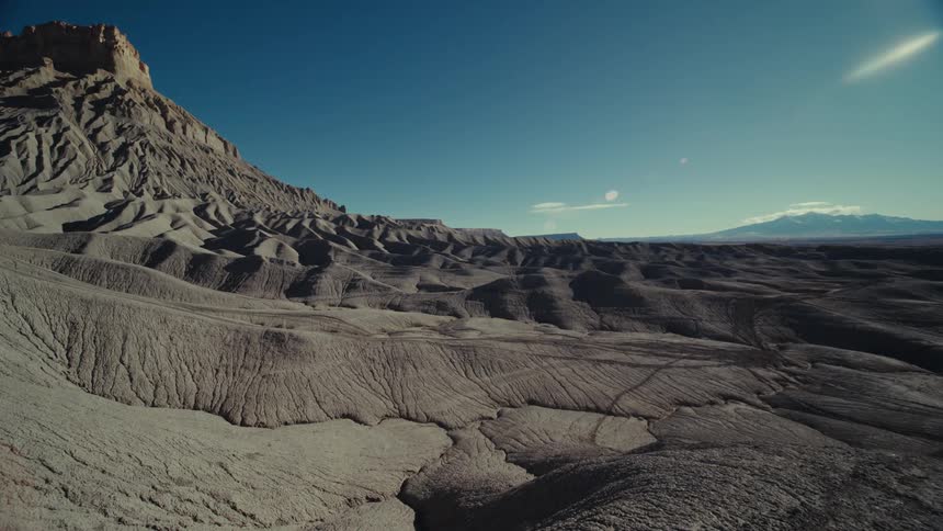 A rocky desert landscape with a mesa