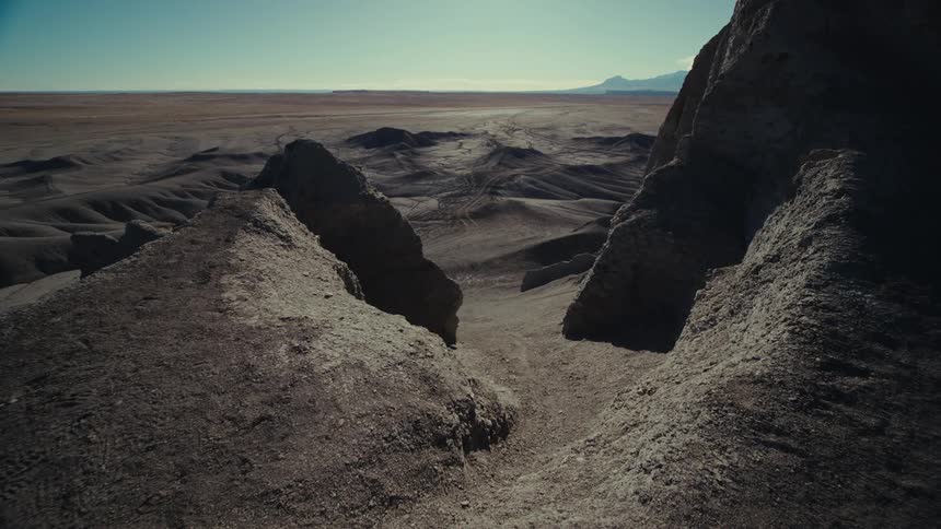 Panoramic view of a rocky terrain on a day with a blue sky