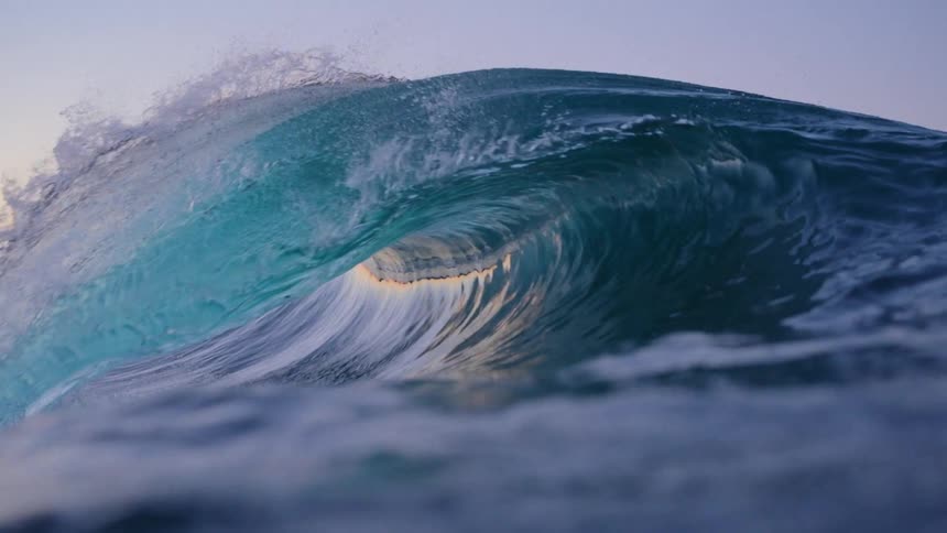 A wave forming in the water and breaking on its own surface