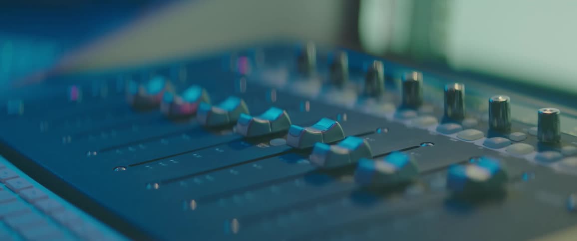 A mixing desks dials moving slowly by themselves