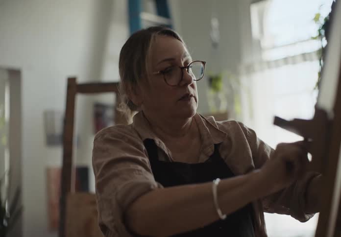 A clip of a lady adjusting a board