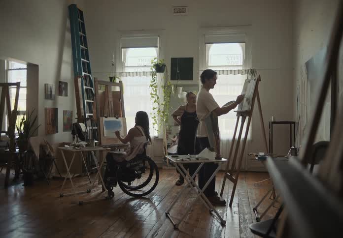 People painting pictures in an art room