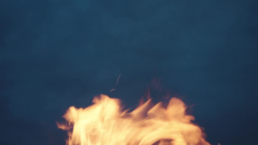 View upwards of the ember of fogo with the sky with clouds at night