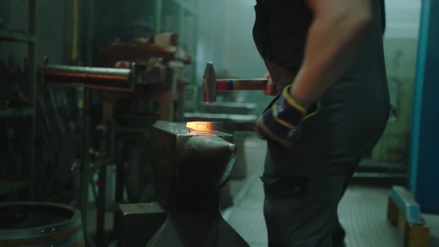 Worker forging hot iron