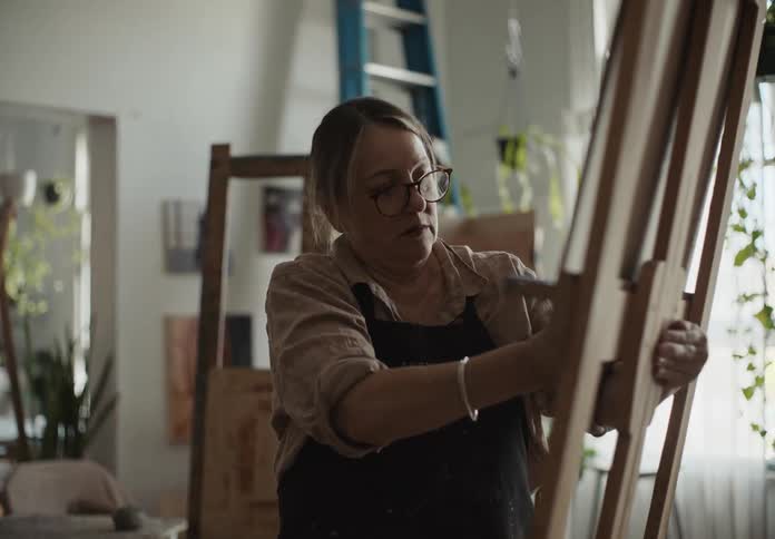 A clip of a lady adjusting a board
