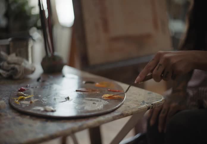 A person is mixing paints
