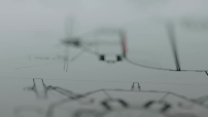 Extreme closeup of a cardboard with designs or blueprints