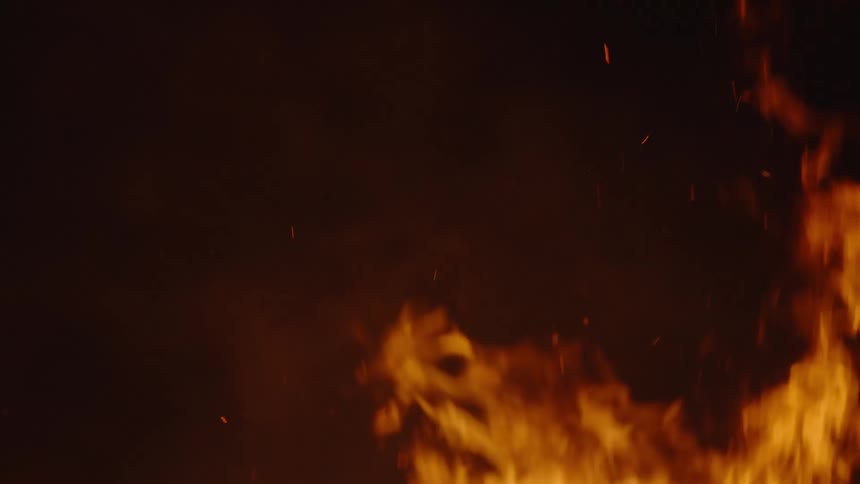 View of the night sky with flashes of fire and smoke