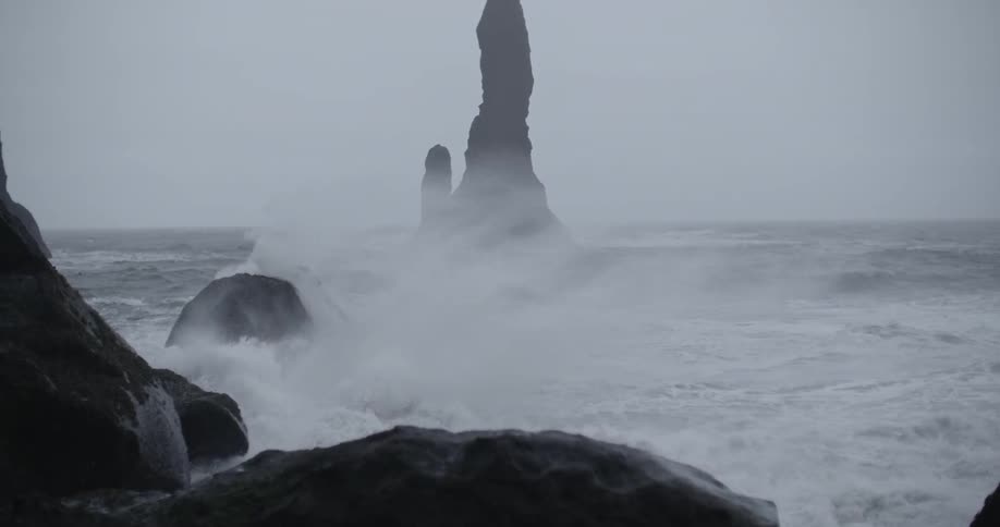 Waves are crashing against rocks
