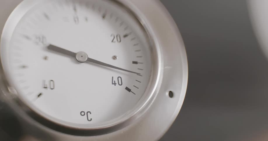 A temperature reading device like a clock