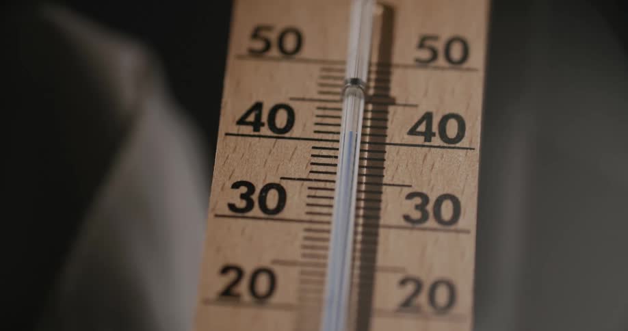 The liquid in a thermometer rises