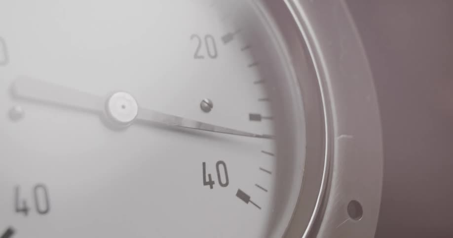 A slowly rotating tachometer needle