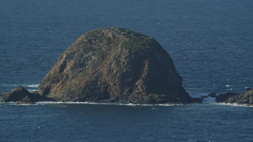 An island sits in the ocean