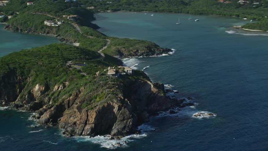 Aerial of a mountainous island on a sunny day