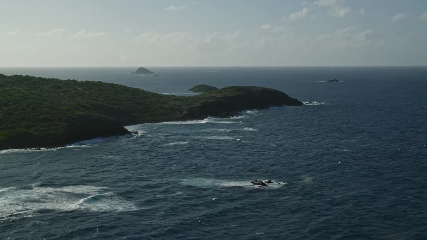 Aerial panorama of a seaside island on a morning with few clouds