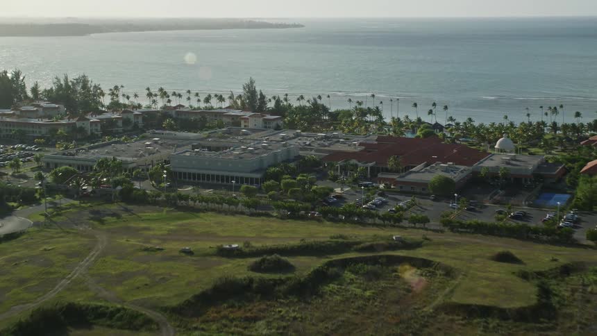 Aerial view of a resort on a small tropical island
