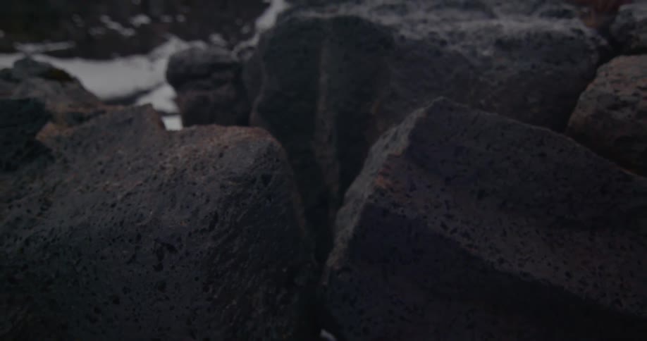 Rocks stand scattered amongst the snow