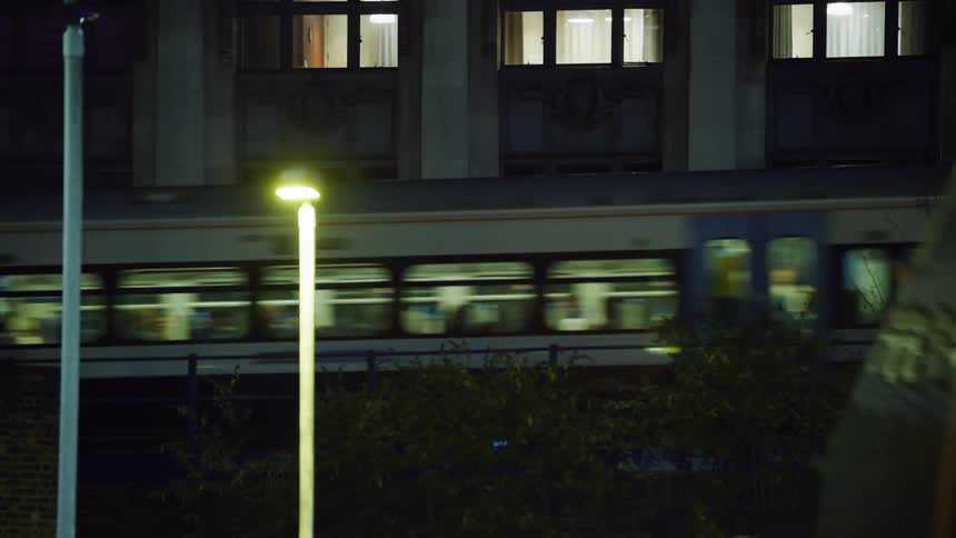 A train moves through an urban area