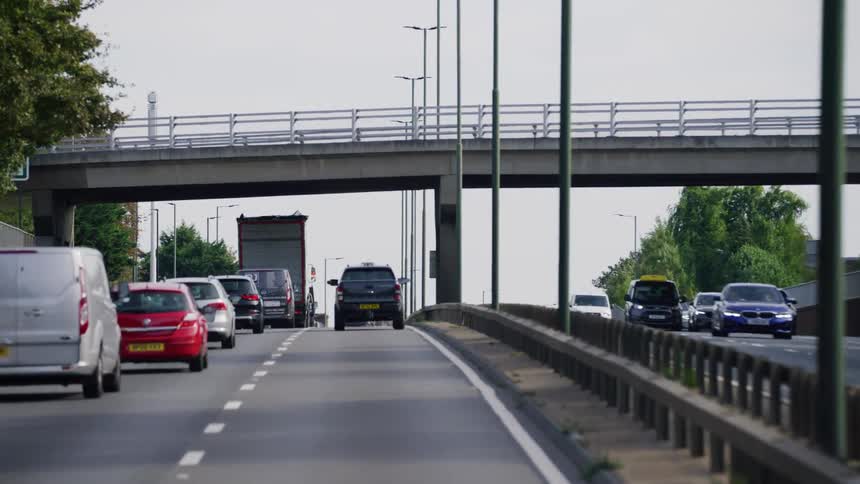 Heavy traffic moves down a highway